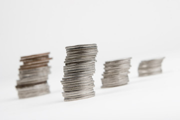 Some stacks of coins on white