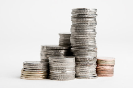 Stacks of coins on white