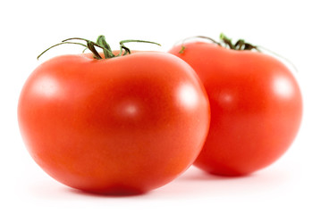 two tomatoes isolated on white