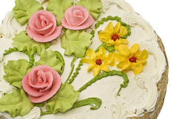 Obraz na płótnie Canvas Close-up of tasty cake with cream, pink roses