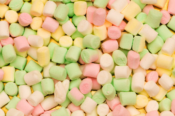 Various dry colourful sweets arranged as background