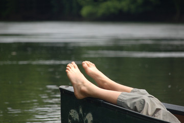 Lazy feet in canoe