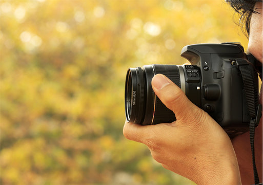 Fototapeta Photographer Taking A Shoot With A Digital Camera