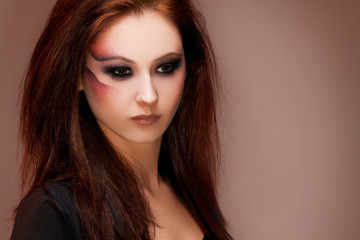 Fototapeta premium young beautiful brunette woman with artistic makeup