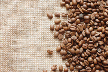 coffee beans on a burlap texture background