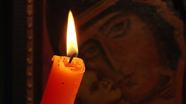 candle and Christian Orthodox icon
