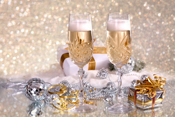 Crystal Glasses with champagne and gifts in festive packaging