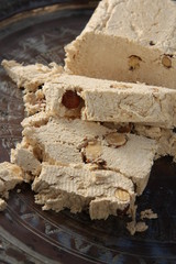 Halva with almonds, made of crushed sesame seeds and honey