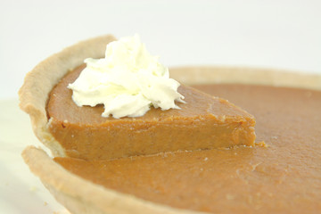 Pumpkin pie with whipped cream.