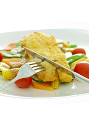 breaded fish fillet with vegetables