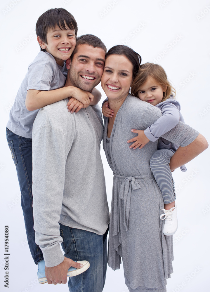 Wall mural Happy parents giving children piggyback rides