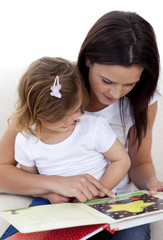 Mother and daughter reading a book