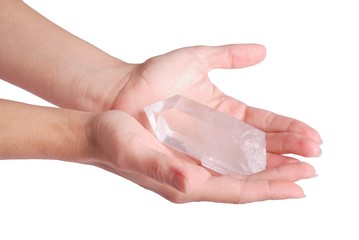 Hands offering quartz crystal