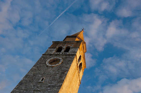 Old mediterranean church tower made of stone