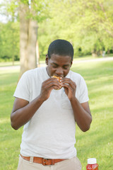 Teenage Boy Eating a Hamburger