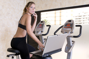 stressed executive woman doing exercise and working lap top