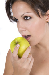 pretty woman eating green apple