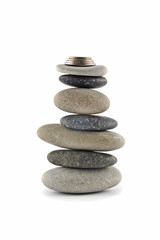 Fototapeta na wymiar Welfare and Stability - Balanced stone stack with coins