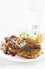 chicken thighs whit parsleyed new potatoes