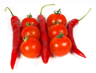 Red peppers and cherry tomatoes isolated on white