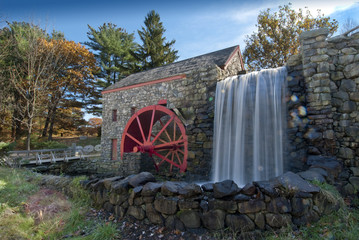 old grist mill with water wheel used to power grinding stones