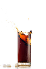 ice drops into cola with splash