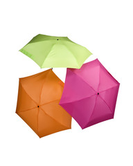 three colored umbrellas green pink orange color isolated on white background