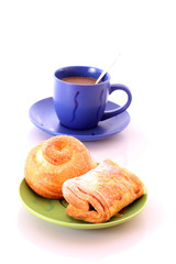 Buns and cup of coffee on white