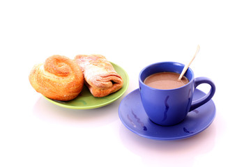 Buns and cup of coffee on white