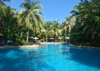 Foto op Plexiglas swimming pool in china hotel with palm trees © Evgenia