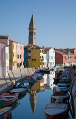 Burano island in lagoon of Venice  famous brightly-colored house © Tamara Kulikova