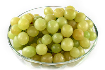 Green grapes in glass bowl isolated