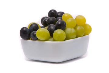 Green and blue grapes on a studio white background