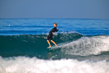 Nose Riding Surfer