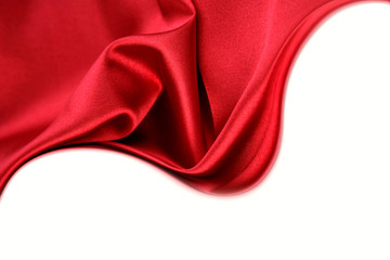 Red silk fabric on white. Copy space