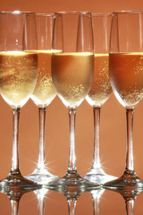 Sparkling wine on salmon background