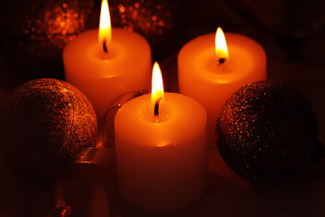 Christmas decorations, candles, ball and ribbon