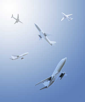 Five airplanes flying in different directions over the viewer