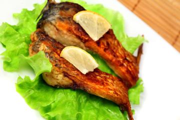 Roasted fresh bream on a plate