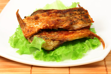 Roasted fresh bream on a plate