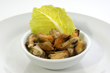 some organic mussel in a white bowl