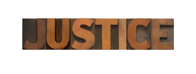 the word justice in old wood type