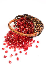 Ripe grains of a pomegranate in a basket.