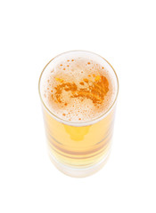 Glass of fresh golden beer isolated on white