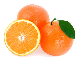 Ripe oranges with green leaf.