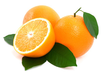 Ripe oranges with green leaves