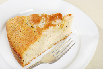 slice lemon poppy seed cake on a plate