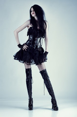 Young slim goth woman