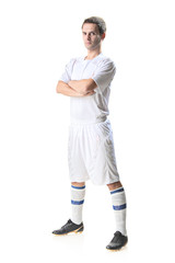 Soccer player standing isolated on white background