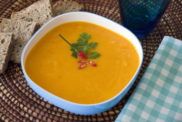 Orange soup served with bread